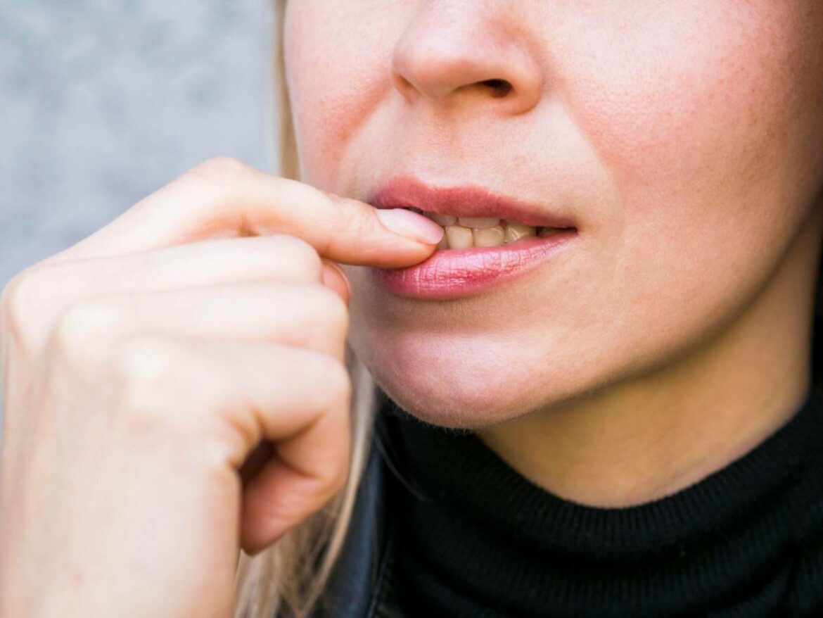 front-view-nail-biting-bad-habit-concept-1 how to fight gum disease